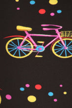 Load image into Gallery viewer, Lovely pink bicycles with various colored polka dots grace this black background.