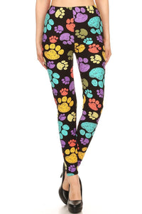 Adorable multi colored paw prints on a black background.