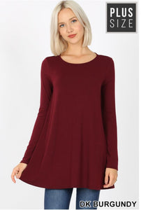 A premium fabric, long sleeve boat neck, flared top with side pockets.