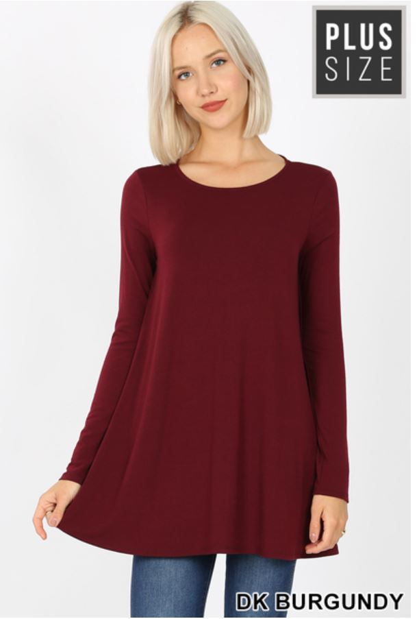 A premium fabric, long sleeve boat neck, flared top with side pockets.